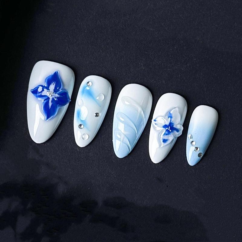 Blue Floral Press On Nails with 3D Flowers and Rhinestones – Icy White and Baby Blue Gradient Almond Nails. Artificial reusable trendy art.