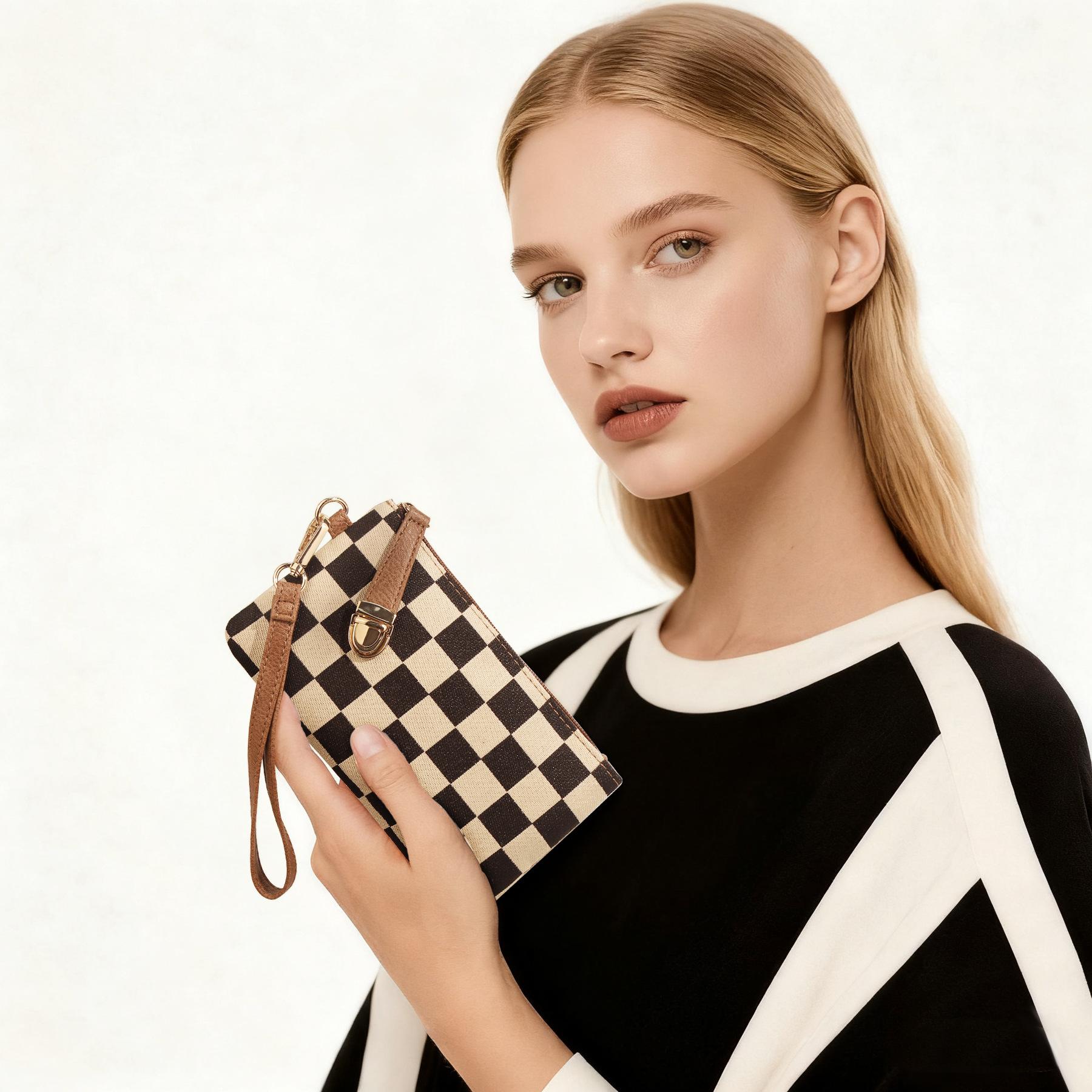 Women’s upgraded high-quality fabric; fashionable, portable long wallet with a checkered pattern; holds a phone; detachable wrist strap; premium gold zipper; gold accents; small everyday carry item.