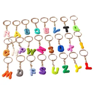 The new 26 letter keychains features a stylish rose letter keychains and a fresh and creative English letter accessory pendant.