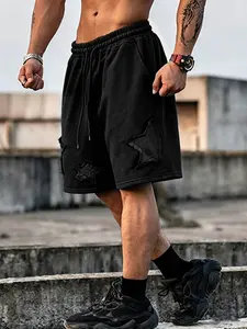 Men's loose drawstring wide-leg shorts, washed vintage style, with appliqué embroidered stars.