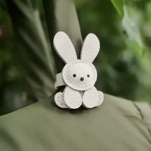 An interesting and cute PU rabbit bag accessory, adorable mini decoration for backpacks, handbags, and luggage with stainless steel clasp