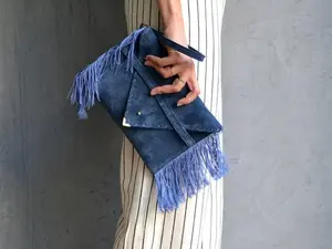 Medusa clutch in raf blue with silk fringes