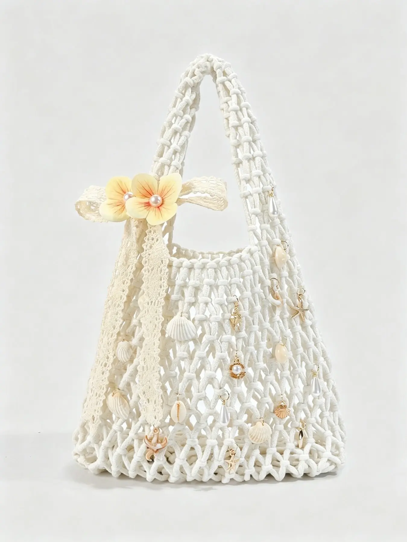 Fresh and practical texture woven shoulder bag, embellished with shell, pearl, and ocean elements, lace ribbon, woven long shoulder strap, beige background, suitable for party/vacation dressing scenes, Textured Bag