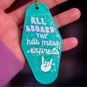 All Aboard the Hot Mess Express Glitter Resin Motel Keychain With Rainbow Holographic Lettering