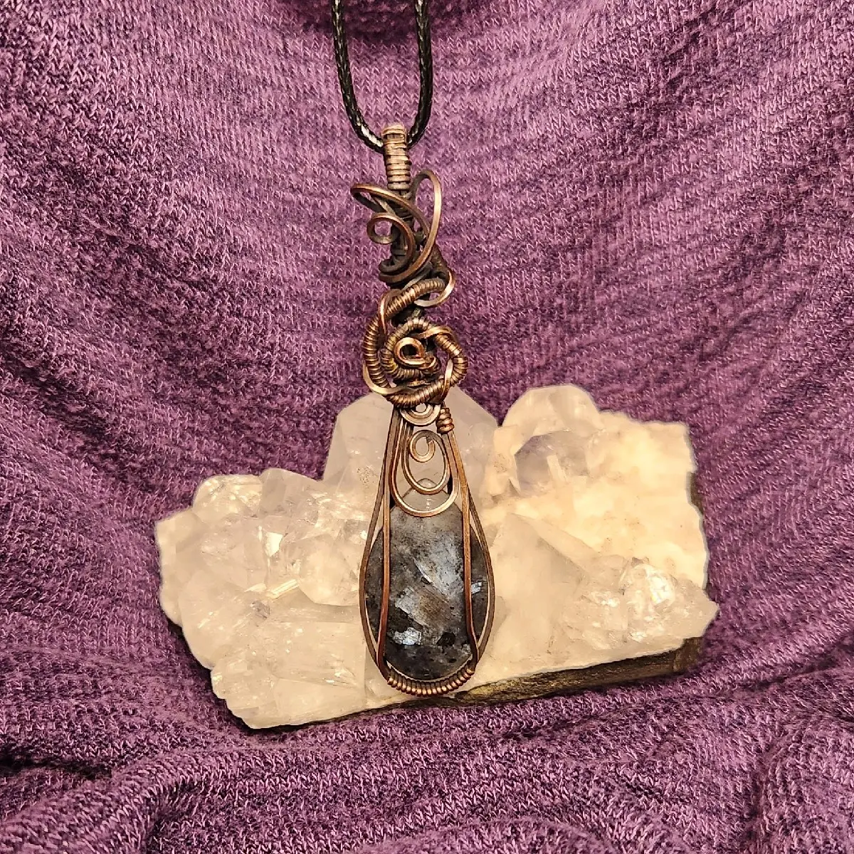 Iolite crystal pendant necklace. Iolite crystal pendant necklace.