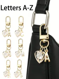 Elegant gold letter keychain, inlaid with sparkling hollow diamond heart pendant, A-Z three-dimensional letter pendant, fashionable alloy key ring, backpack charm car keychain, a perfect accessory suitable for women's daily use