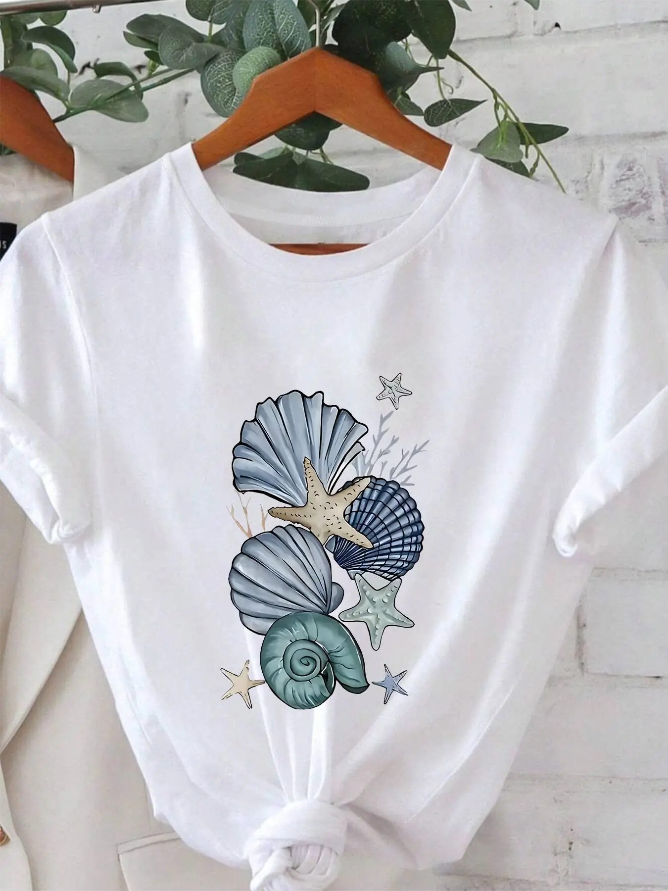 Coastal Treasures Fresh Seashell & Starfish Ocean Graphic Print Women's T-shirt, Short Sleeve Crew Neck Casual Top for Summer & Spring, Women's Clothing