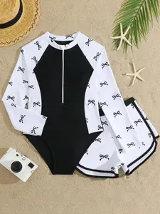 Teen Girls Modest Bow Print Long Sleeve Zip-Up One-Piece Swimsuit With Shorts