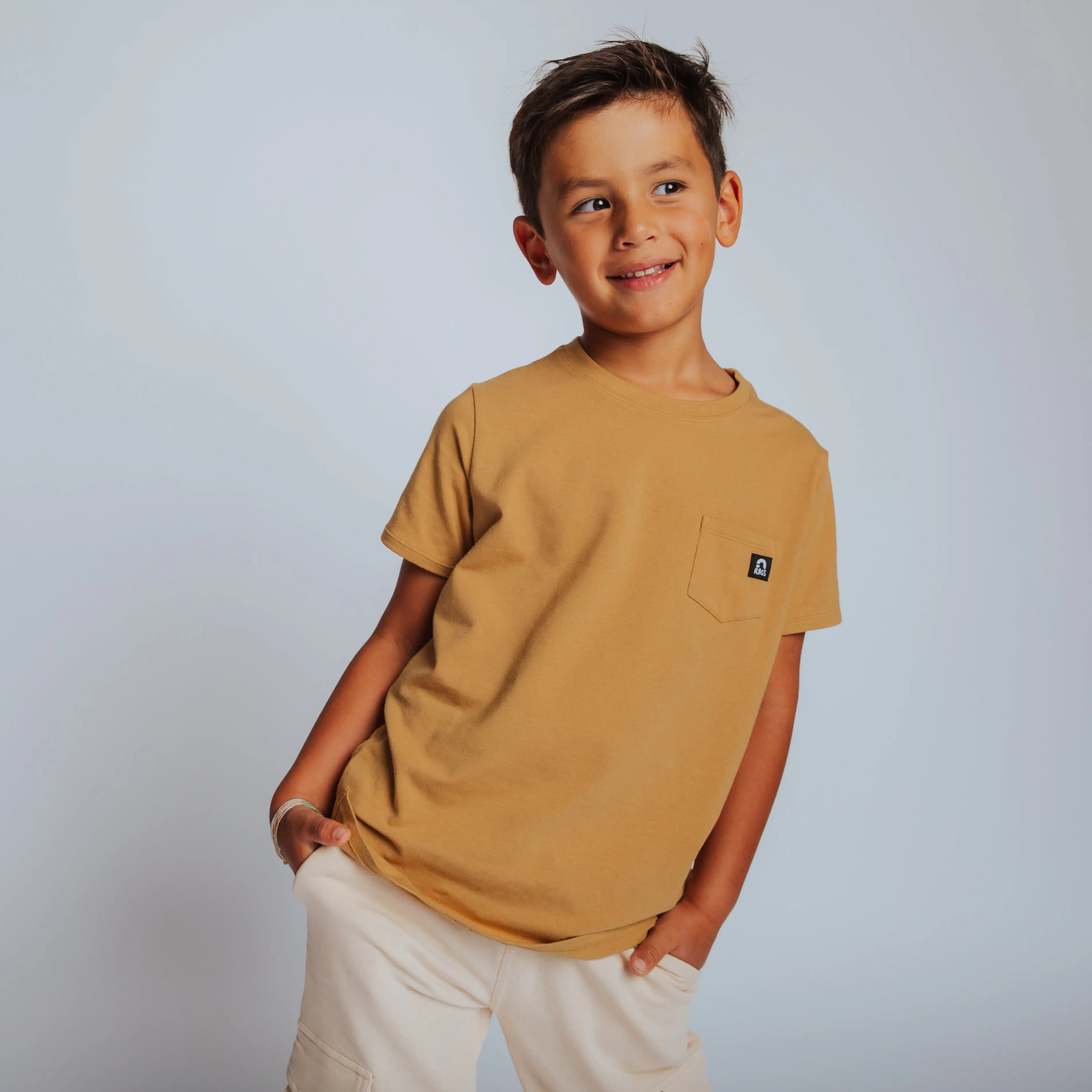 RAGS Apparel Kids' Buttery Soft Casual Short Sleeve Tee with Chest Pocket, Season Long Basic Top in Curry, Kids Clothing, Casual Tee, Kids Wear