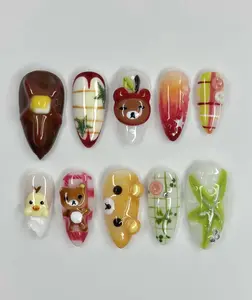 Adorable kawaii bear and dessert-themed gel nails with mochi textures, matcha plaid, honey tones and playful 3D character accents — perfect for a sweet cozy vibe