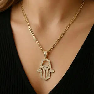 Elegant Hamsa Hand Pendant Necklace with Sparkling CZ Stones on Gold Tone Chain for Women Stylish Accessory Ideal for Everyday Wear or Special Occasions