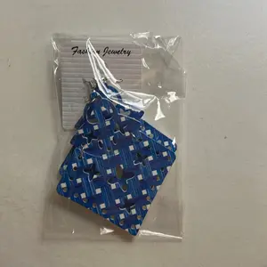 Unique, diamond shaped earrings have a hinge point towards the top of the earring and comes in multiple colors