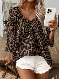 A women's leopard print V-neck loose-fit chiffon top with mid-length sleeves, featuring a chic casual style, suitable for daily outings, dates, vacations, and more.