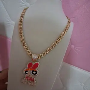 Rolo Chain style 20  inches long with green catoon pendant
