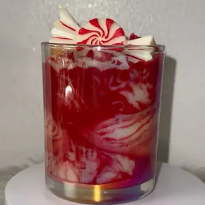Katiria Essence Peppermint Swirl Candle with Festive Red and White Design for Cozy Atmospheres