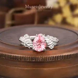 Pear Pink Sapphire Leaf Engagement Ring in White Gold with Moissanite Dewdrops — pear pink sapphire ring white gold leaf branch moissanite halo promise handcrafted LA made to order 7-10 days art deco anniversary gift