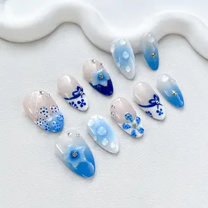 Iridescenal Blue Blossom Waterdrop Press-On Nails | Floral Fantasy Design for Women & Teens | Long Glossy Almond Fake Nails with 3D Flowers, Bows & Stars | Reusable & Summer-Ready Nail Art Set