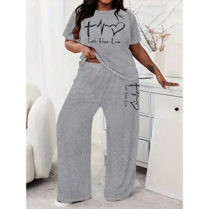 Plus size two-piece set featuring a letter-print T-shirt and pants; casual crewneck short-sleeve T-shirt and pants; casual outfit; women’s summer everyday wear; women’s clothing