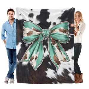 Western Cowhide Teal Bow Flannel Blanket Rustic Farmhouse Throw with Cowhide Print & Teal Bow Design – Ultra-Soft, Cozy, Perfect for Western Decor, Country Homes, Cozy Nights and Thoughtful Gifting.