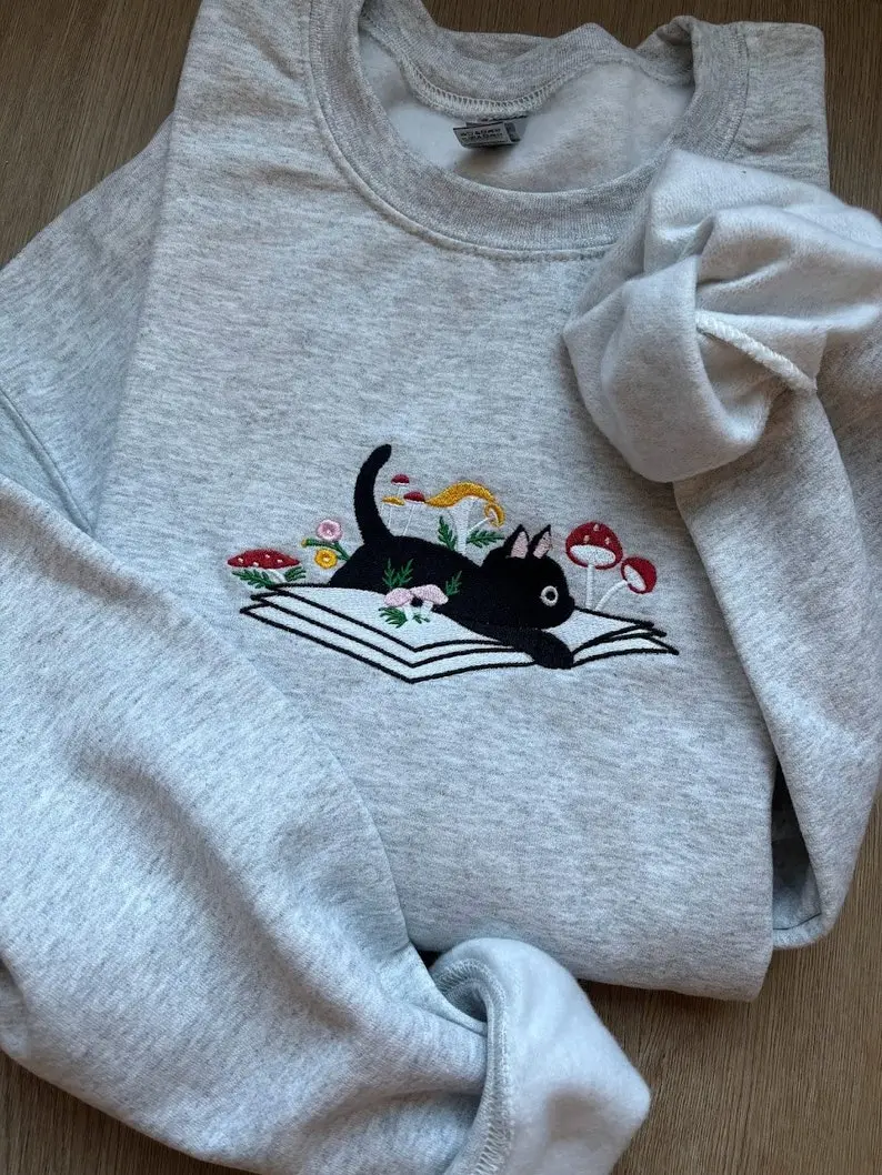 EMBROIDERED Cute Cat On Book Sweatshirt, Daisy and Mushroom Floral, Gift for Cat Lover, Floral Gift, Librarian and Teacher Sweater, Bookish