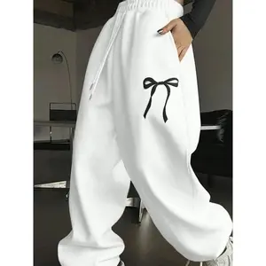 Women’s cartoon bow print sweatpants, casual streetwear pants, casual street jogger pants with pockets for daily wear, ladies’ fall and winter trousers