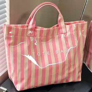 Striped large-capacity makeup bag - Waterproof PVC glossy hand-held storage bag - Insulated, color-blocked letter print - Travel skincare and makeup storage bag - Student-friendly portable toiletry bag