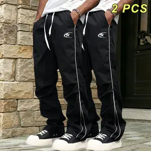 Men’s printed jogger pants with side stripes; loose straight-leg casual wide-leg sweatpants with a drapey, slimming long length that flatters leg shape regardless of body type; adjustable drawstring elastic waistband; suitable for everyday commuting and c