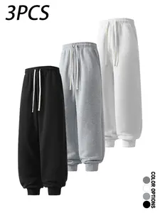 Pack of 3 men’s casual sweatpants for spring/autumn, cuffed long pants with a simple solid color design, elastic waistband with drawstring, loose fit for everyday wear, leisure, sports, and fitness.