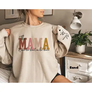 [custom in description] Custom This Mama Wears Her Heart On Her Sleeve Hoodie, Personalized Mom Sweatshirt With Kids Names, Cute Momma Outfit, Mothers Day Gifts