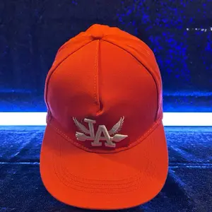 Orange Hat with Wing LA Logo - Stylish and Comfortable Baseball Cap for Everyday Wear