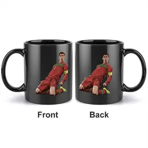 1pc 11oz black ceramic Novelty Coffee Mug featuring a cartoon-style image of Cristiano Ronaldo kneeling and celebrating, with an exaggerated dynamic design and a double-sided print of a football-themed star, a classic commemorative cup for football fans.