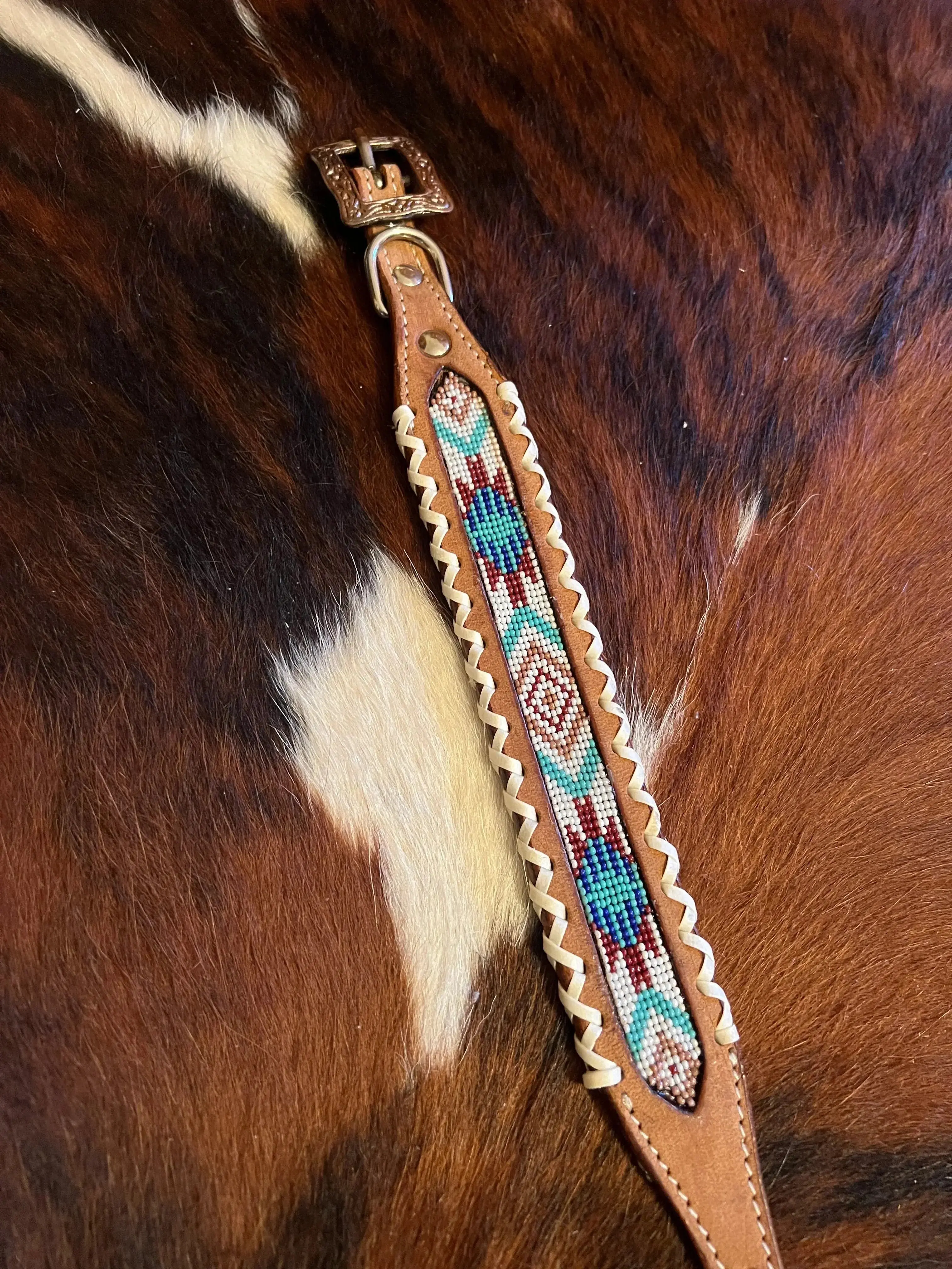 Genuine leather dog collar with teal, white, and burgundy southwest beaded inlay design and Rawhide edge Genuine leather dog collar with teal, white, and burgundy southwest beaded inlay design and Rawhide edge