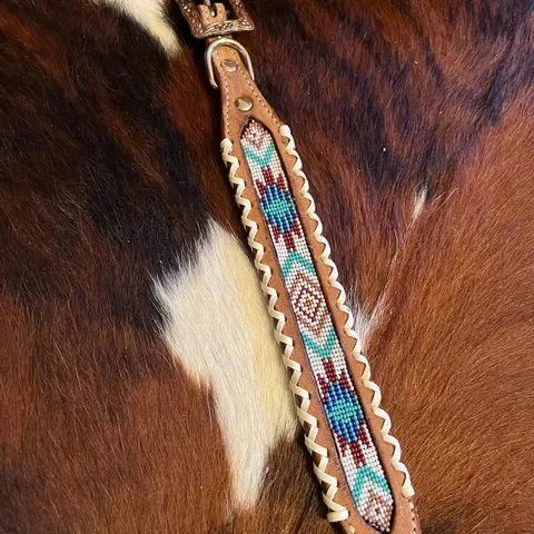 Genuine leather dog collar with teal, white, and burgundy southwest beaded inlay design and Rawhide edge