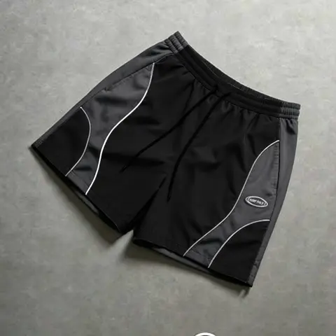 Men’s summer fashion athletic casual shorts with an elastic waistband and drawstring, color-block design, loose fit, suitable for outdoor running, basketball, and the beach in summer.