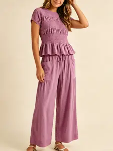 Women's Fashion Casual High-End Textured Cotton Ruffled Short Sleeve Two-Piece Set, with waist-cinching ruffles and a flowing wide-leg pant design, perfect for summer, vacations, indoor, and outdoor wear