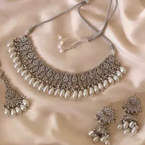 Elegant Beaded Necklace Set with Matching Earrings and Tikka for Festive Wear Featuring Pearl Accents and Intricate Design