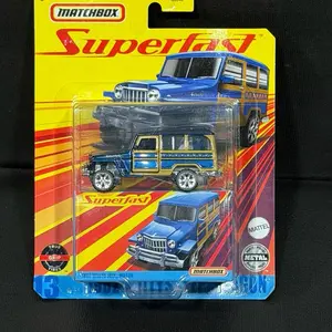 This item is a Matchbox Superfast 1962 Willys Jeep Wagon diecast collectible vehicle in its original packaging. It features a blue and gold finish, rubber-like "True Grip Tires", and metal construction.