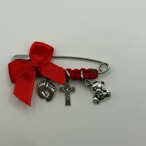 Safety Pin for Pregnancy with Red Bow and Charms Including Cross and Teddy Bear