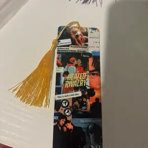 Heated Rivalry Bookmark with Gold Tassel and Sports-Themed Design for Book Lovers