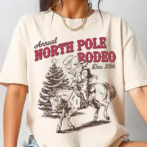Cowboy Santa Christmas Unisex T-shirt, North Pole Rodeo Western Holiday Clipart, Vintage Rodeo Xmas Graphic, Funny Cowboy Shirt, Vintage Rodeo, For Men and Women Menswear Womenswear