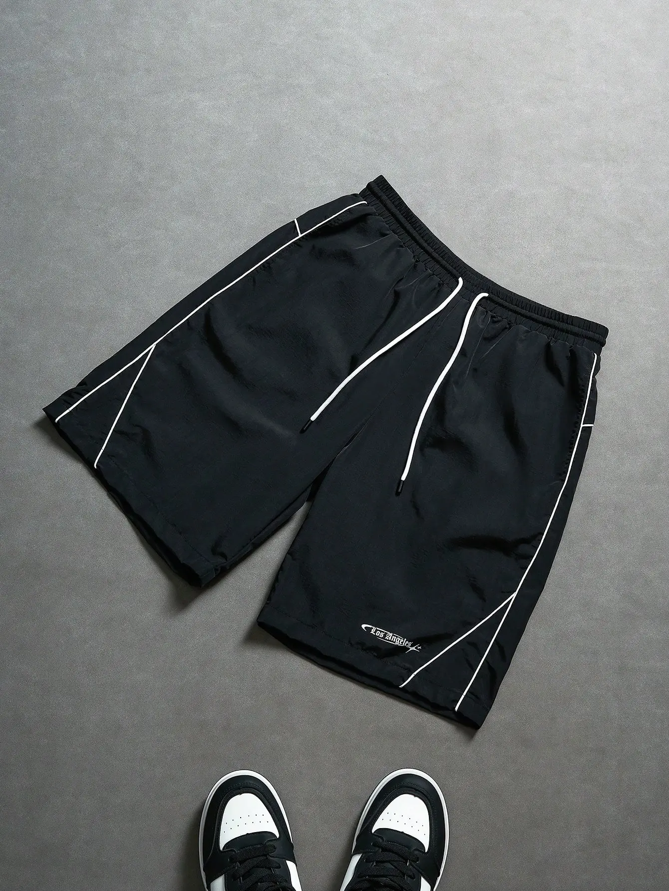 Men’s summer casual letter-print drawstring-waist shorts with side stripes; lightweight, breathable, and wear-resistant—street-casual style, versatile for everyday wear.