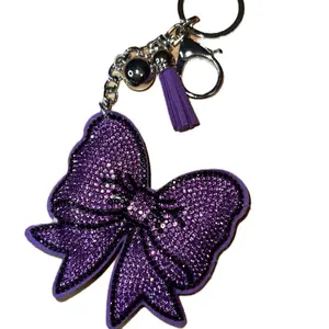 Purple Bow Bag Chain or Keychain with Glittery Design and Tassel Accents for Stylish Accessory