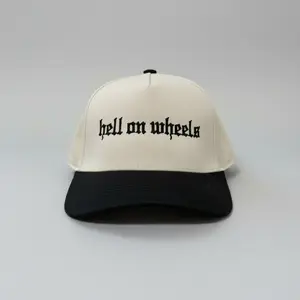 Hell on Wheels Trucker Hat with Natural Crown Black Brim and "Hell on Wheels" Embroidery Structured Fit Adjustable Snapback One Size Fits Most Premium Quality Cap