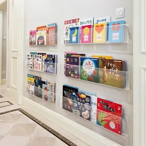 Wall-mounted bookshelf behind the children's door in the hallway. Promotional magazine. No hole punching required. Transparent acrylic bookshelf for wall display. Wall Mount Organizer