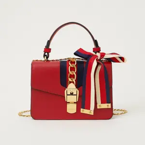 Women's Red Leather Handbag with Gold Chain Strap and Striped Bow Detail