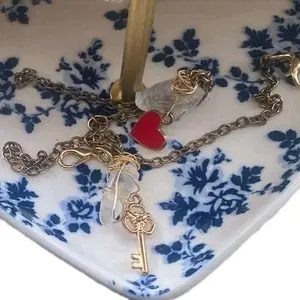 heart locket charm and key charm bracelets with clear quartz stones on copper chain matching bracelets