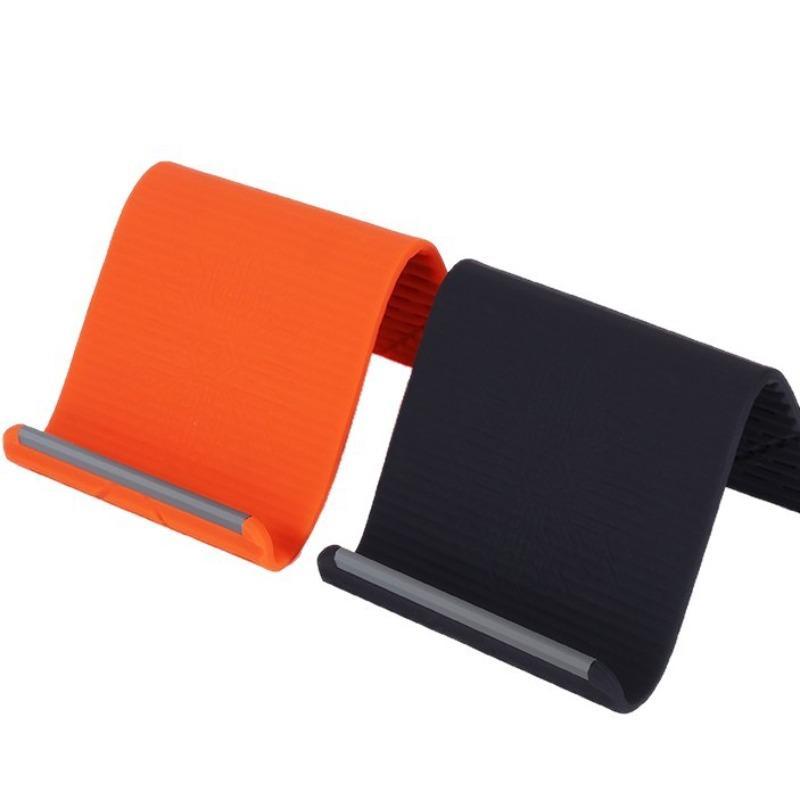 Multifunctional silicone folding mobile phone stand – ideal for frequent users of digital devices. Suitable for use on office desks, in the kitchen for following recipes, for portable storage whilst travelling, and as a non-slip mount in the car.
