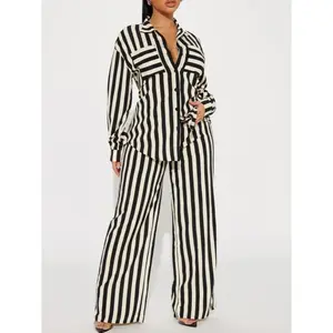 Women's black and white striped lapel long-sleeved button-up shirt and wide-leg pants set. Fashionable women's clothing, suitable for daily wear and office use, suitable for all seasons.GARMENTARY