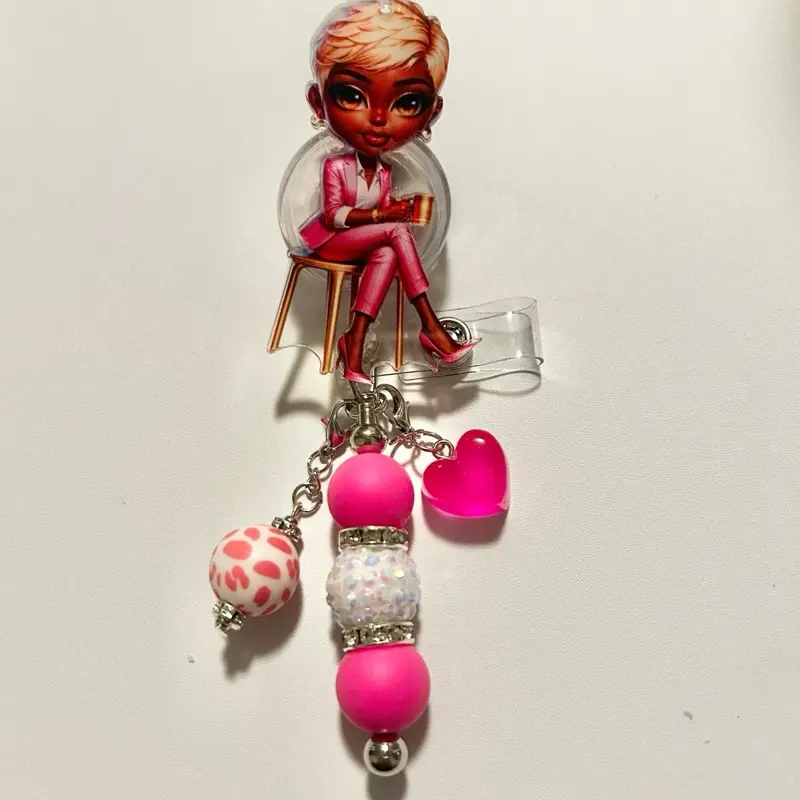 Charmed- Cute trendy retractable badge reel with alligator clip and colorful beads. Charms may vary from photo but will match colors in acrylic piece.