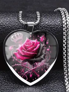 A transparent glass heart necklace with a 2D painted dragon pattern inside.